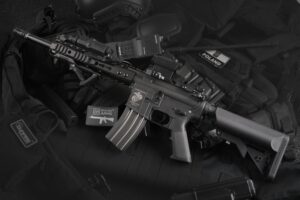 Detailed view of military rifles and tactical equipment, showcasing precision.